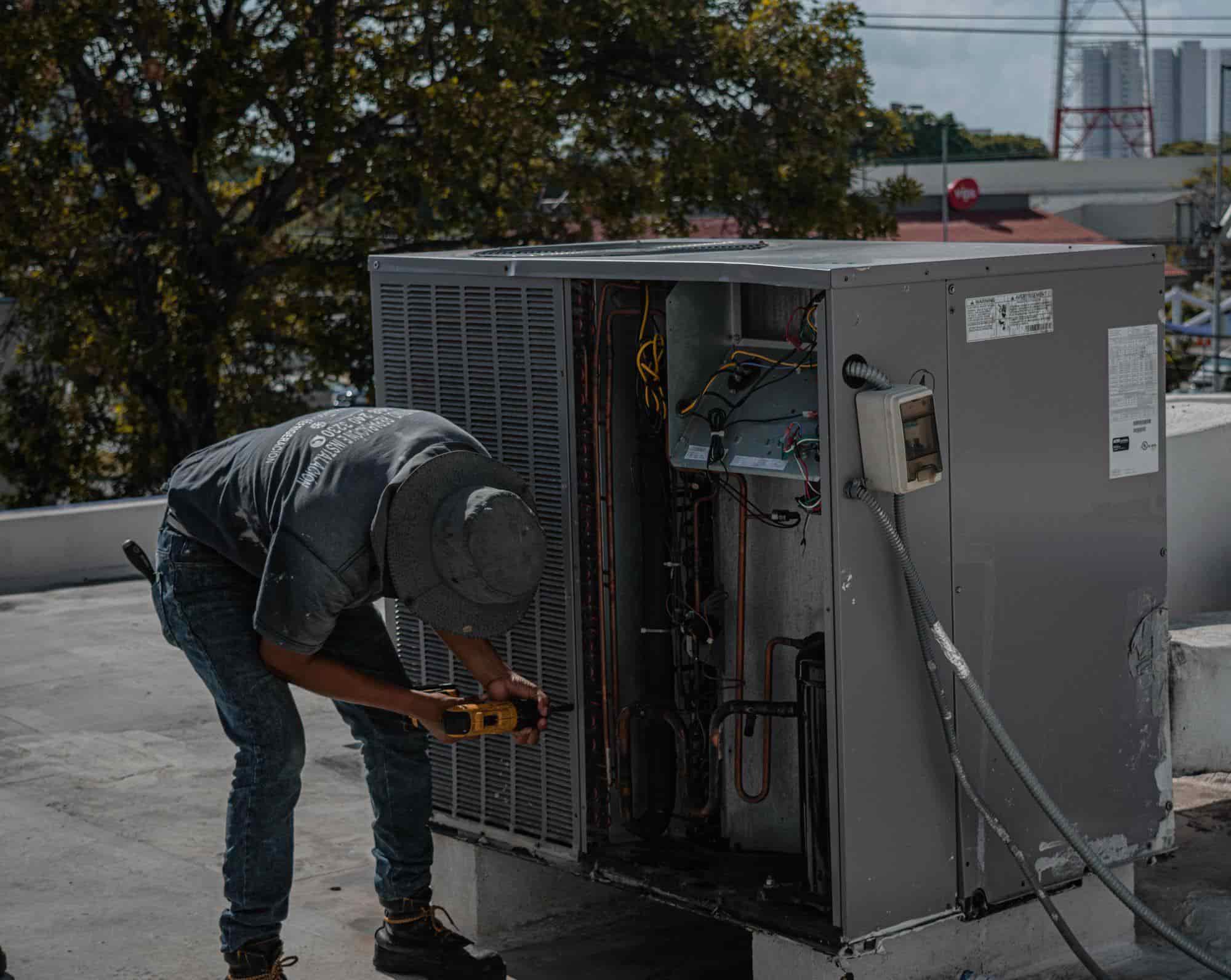 An HVAC technician working on a home system