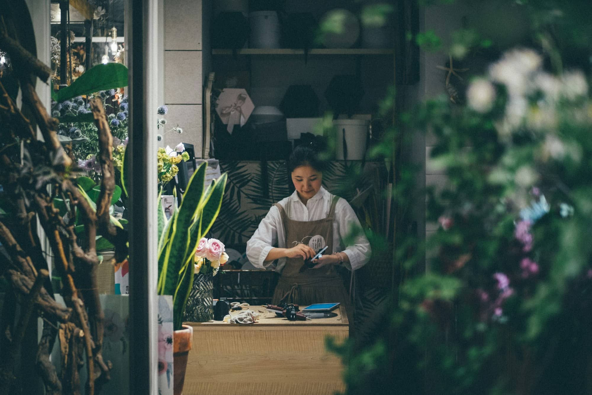 Small business owner running her shop