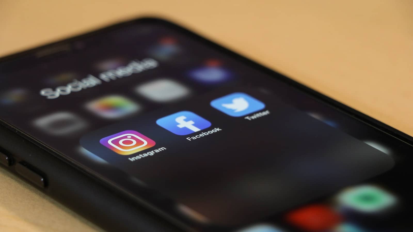 A planned social workflow open across a laptop and a phone