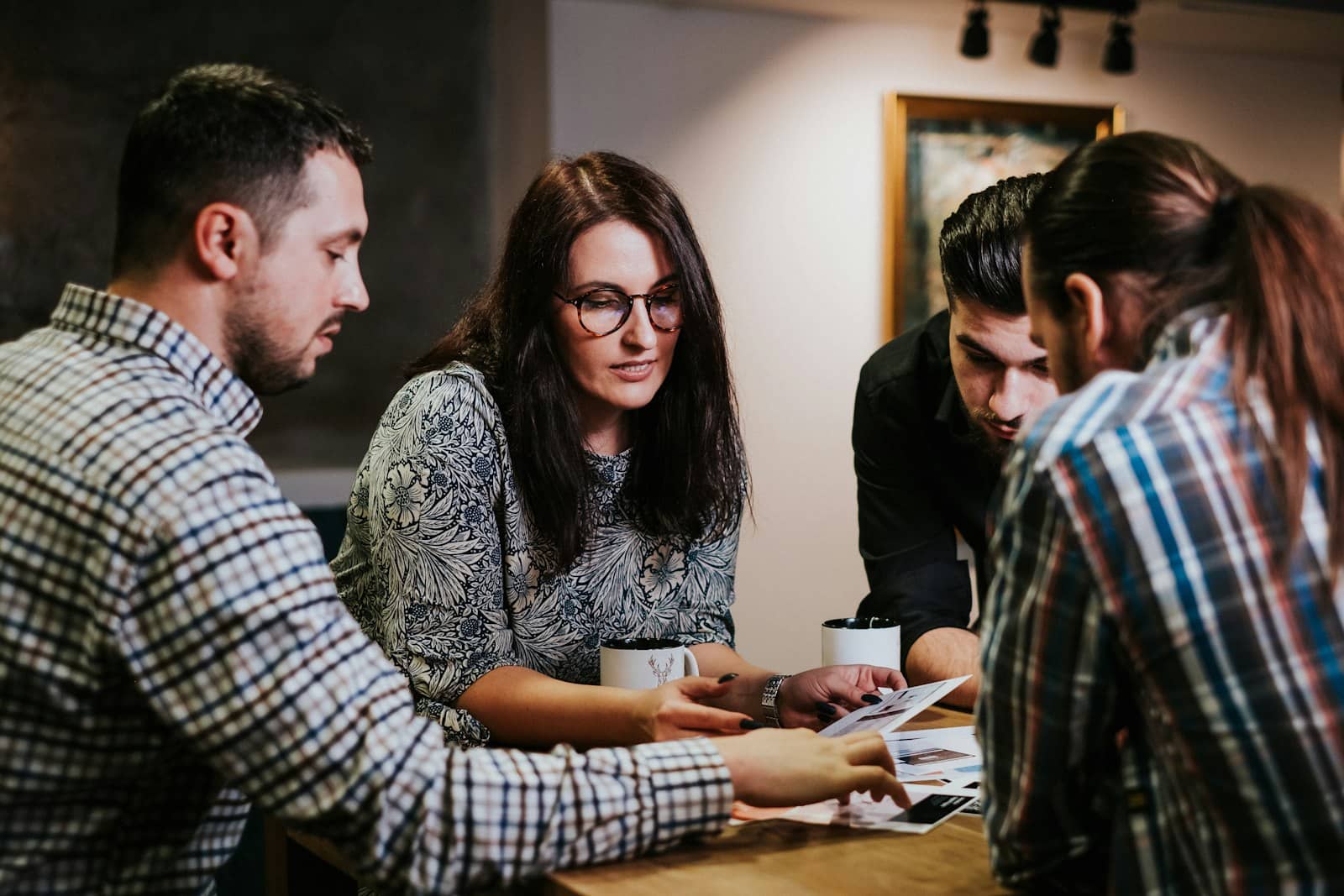 Team planning around a table, reviewing local marketing strategy together