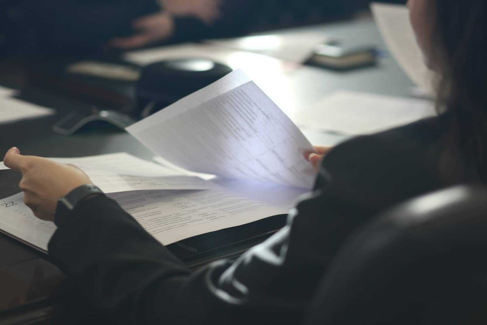 A person at a laptop reviewing a single organized customer record