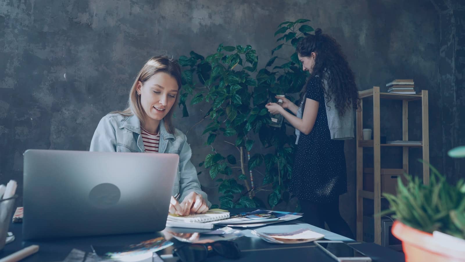 A team planning follow-up tasks and reminders together at a table