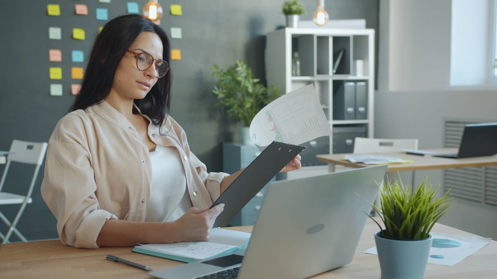 A person reviewing results on a laptop